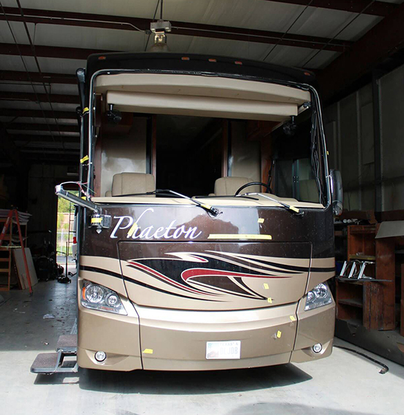 Fiberglass Front-End Cap damage, Windshield needed straightened and repair - Action RV Conroe, TX.